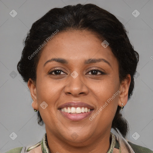 Joyful latino adult female with medium  brown hair and brown eyes