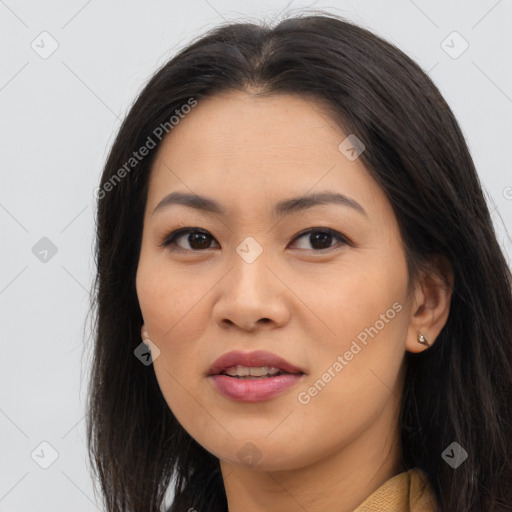 Joyful asian young-adult female with long  brown hair and brown eyes