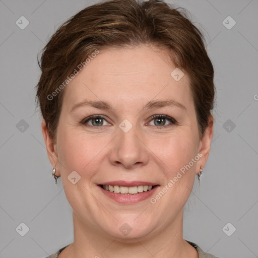 Joyful white adult female with medium  brown hair and grey eyes