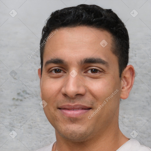 Joyful white young-adult male with short  black hair and brown eyes