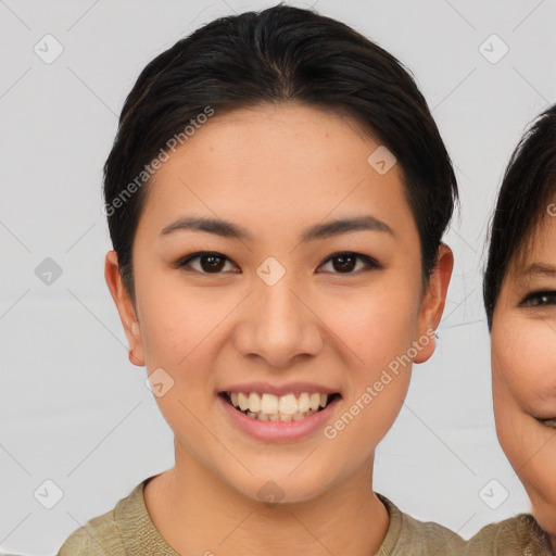 Joyful asian young-adult female with short  brown hair and brown eyes