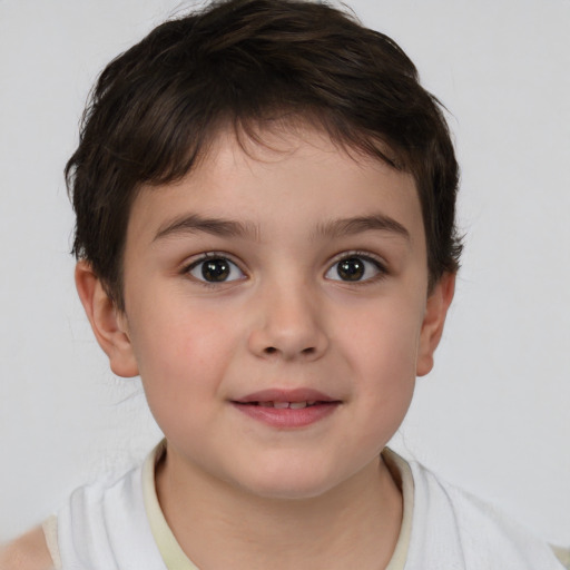 Joyful white child female with short  brown hair and brown eyes