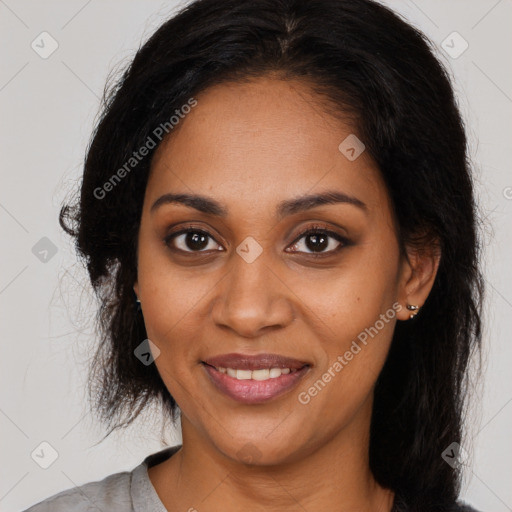 Joyful black young-adult female with medium  brown hair and brown eyes