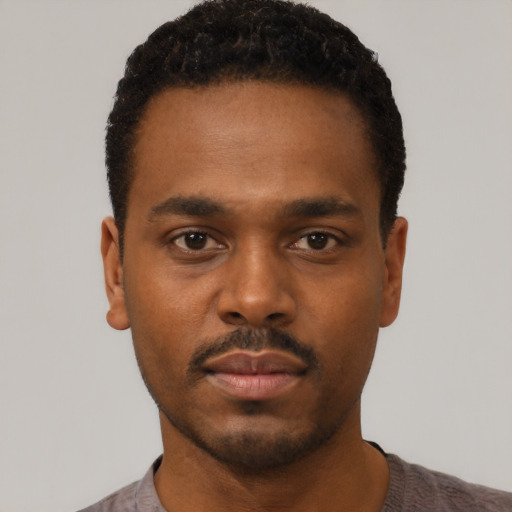 Neutral black young-adult male with short  black hair and brown eyes