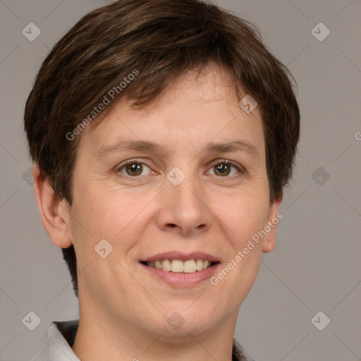 Joyful white adult female with short  brown hair and grey eyes