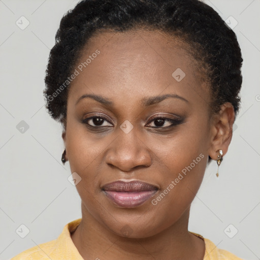 Joyful black young-adult female with short  brown hair and brown eyes