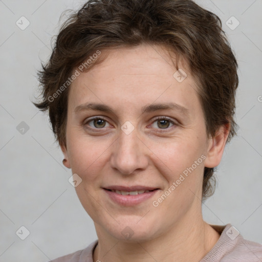 Joyful white adult female with short  brown hair and grey eyes