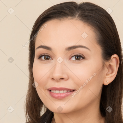 Joyful white young-adult female with long  brown hair and brown eyes