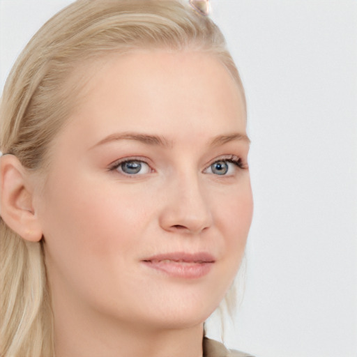 Joyful white young-adult female with long  brown hair and blue eyes