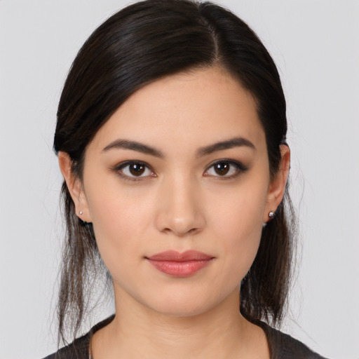 Joyful white young-adult female with medium  black hair and brown eyes