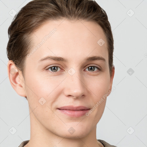 Joyful white young-adult female with short  brown hair and grey eyes