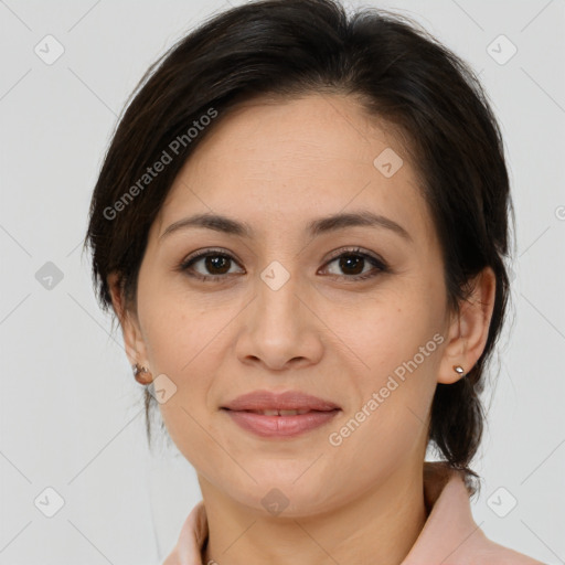 Joyful latino young-adult female with medium  brown hair and brown eyes