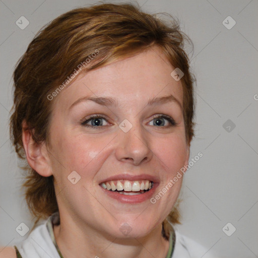 Joyful white young-adult female with medium  brown hair and blue eyes