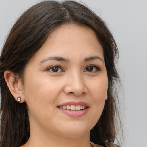 Joyful white young-adult female with medium  brown hair and brown eyes
