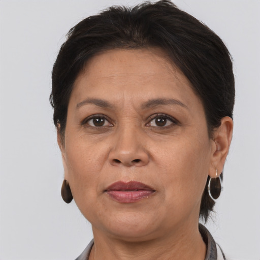 Joyful white adult female with short  brown hair and brown eyes
