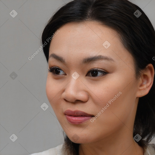 Joyful asian young-adult female with medium  brown hair and brown eyes