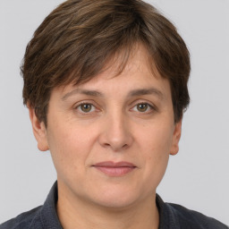 Joyful white adult female with short  brown hair and brown eyes