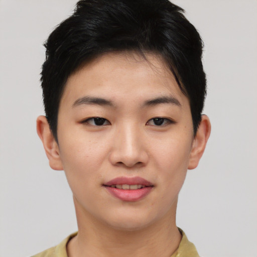 Joyful asian young-adult female with short  brown hair and brown eyes