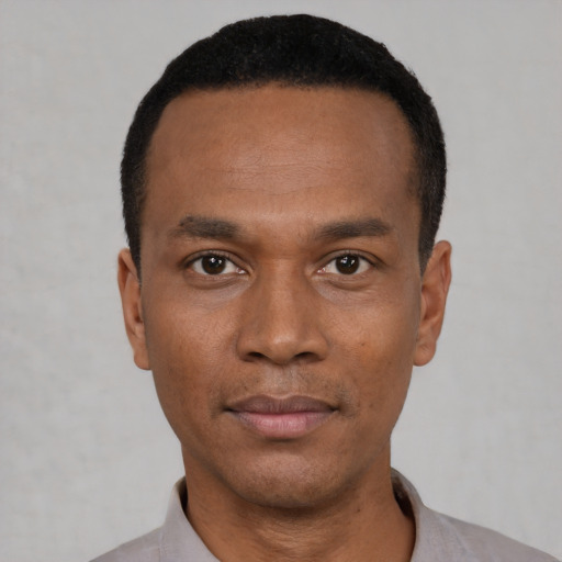 Neutral black young-adult male with short  black hair and brown eyes