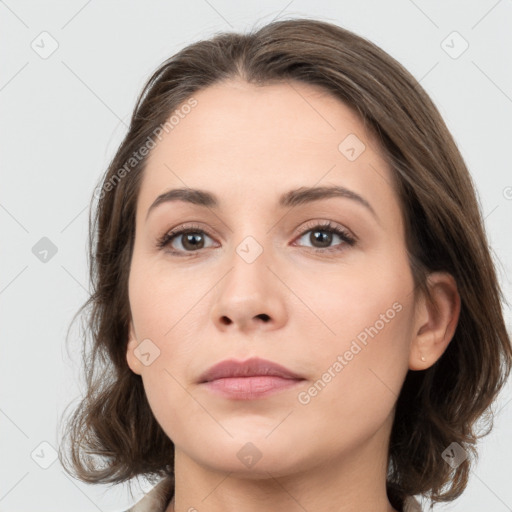 Neutral white young-adult female with medium  brown hair and grey eyes