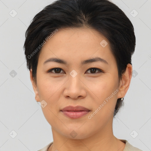 Joyful asian young-adult female with medium  brown hair and brown eyes