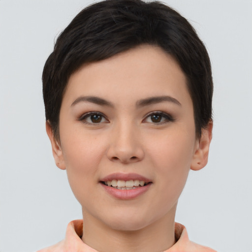 Joyful asian young-adult female with short  brown hair and brown eyes