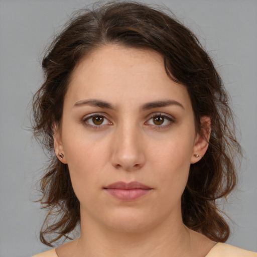 Neutral white young-adult female with medium  brown hair and brown eyes