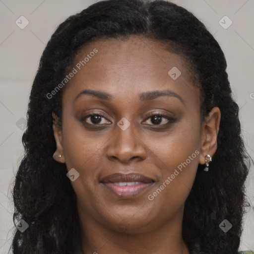 Joyful black young-adult female with long  brown hair and brown eyes