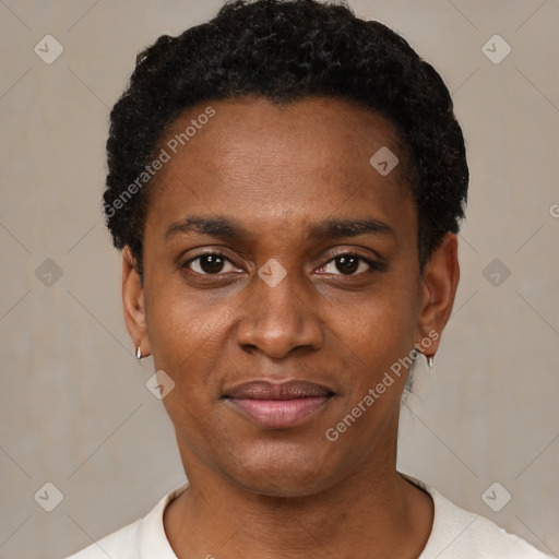 Joyful black young-adult male with short  black hair and brown eyes