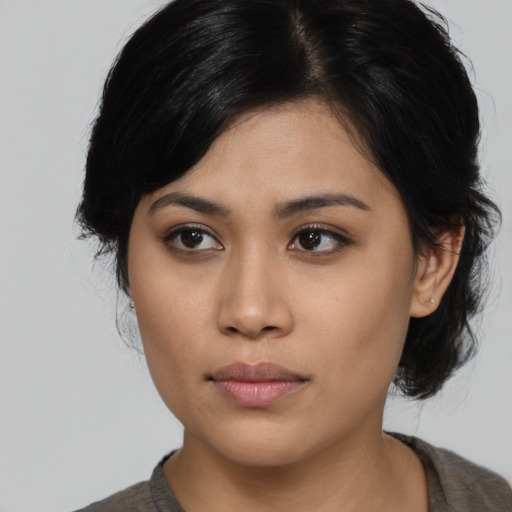 Neutral asian young-adult female with medium  black hair and brown eyes