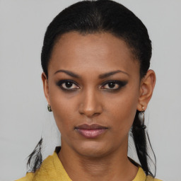 Neutral black young-adult female with short  black hair and brown eyes