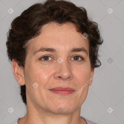 Joyful white adult female with short  brown hair and brown eyes