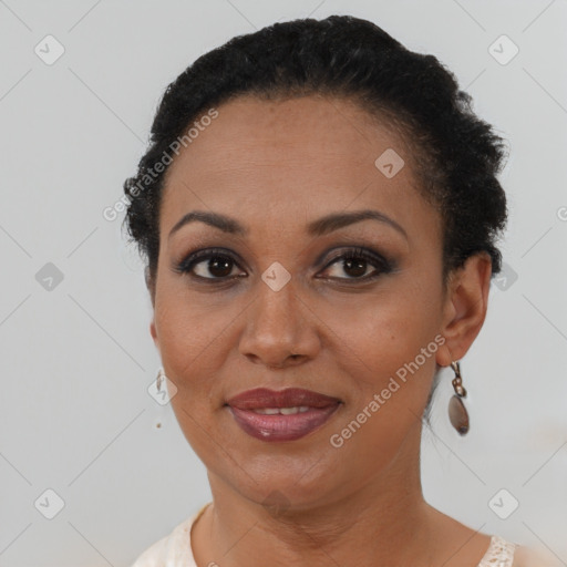 Joyful latino young-adult female with short  brown hair and brown eyes