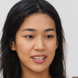 Joyful asian young-adult female with long  brown hair and brown eyes