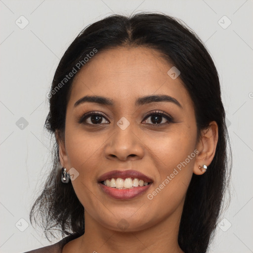 Joyful latino young-adult female with long  brown hair and brown eyes