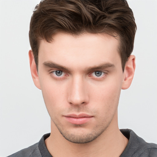 Neutral white young-adult male with short  brown hair and grey eyes