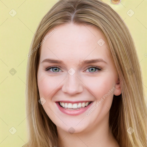 Joyful white young-adult female with long  brown hair and blue eyes