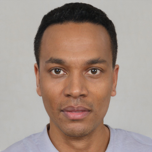 Neutral black young-adult male with short  black hair and brown eyes