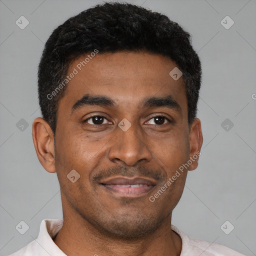Joyful latino young-adult male with short  black hair and brown eyes