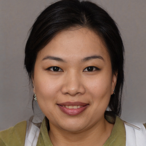 Joyful white young-adult female with medium  brown hair and brown eyes