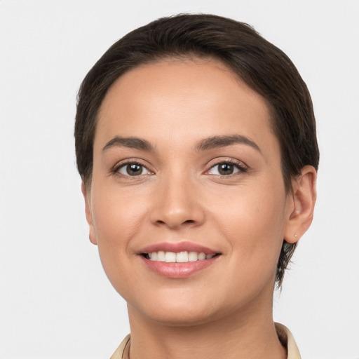 Joyful white young-adult female with short  brown hair and brown eyes