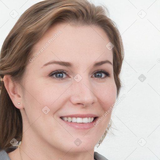 Joyful white young-adult female with medium  brown hair and blue eyes