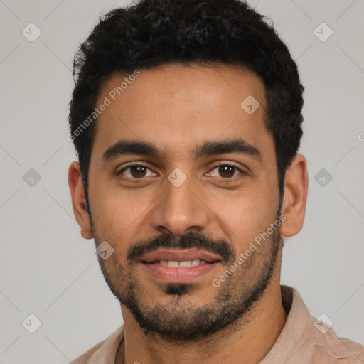 Joyful latino young-adult male with short  black hair and brown eyes