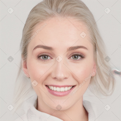 Joyful white young-adult female with medium  blond hair and blue eyes