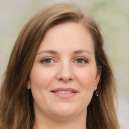 Joyful white young-adult female with long  brown hair and green eyes