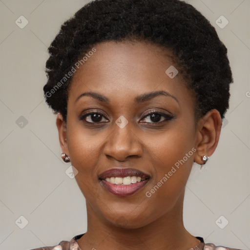 Joyful black young-adult female with short  brown hair and brown eyes