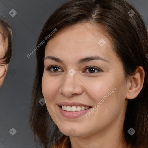 Joyful white young-adult female with long  brown hair and brown eyes
