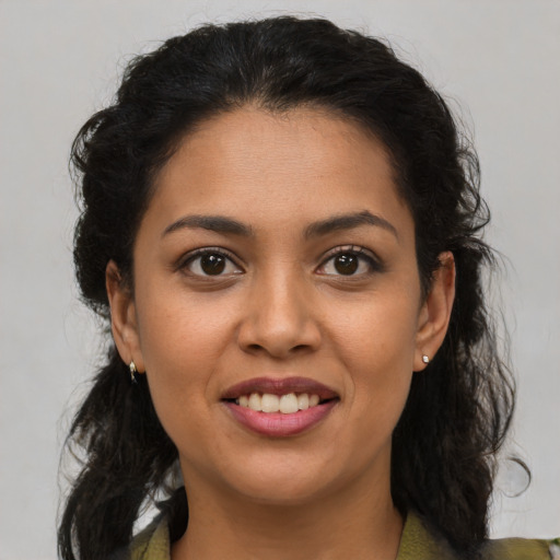 Joyful latino young-adult female with medium  brown hair and brown eyes