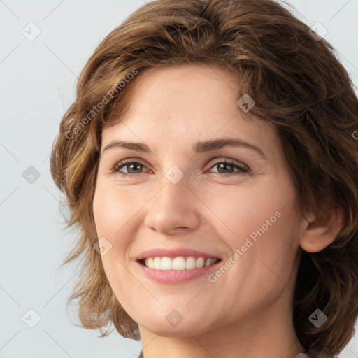 Joyful white young-adult female with medium  brown hair and green eyes