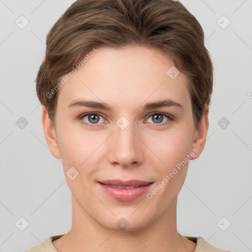 Joyful white young-adult female with short  brown hair and grey eyes